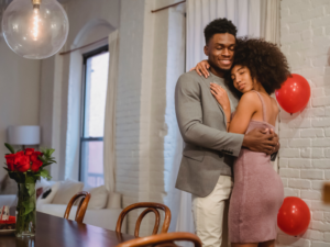 black man and black woman in an embrace on valentine's day